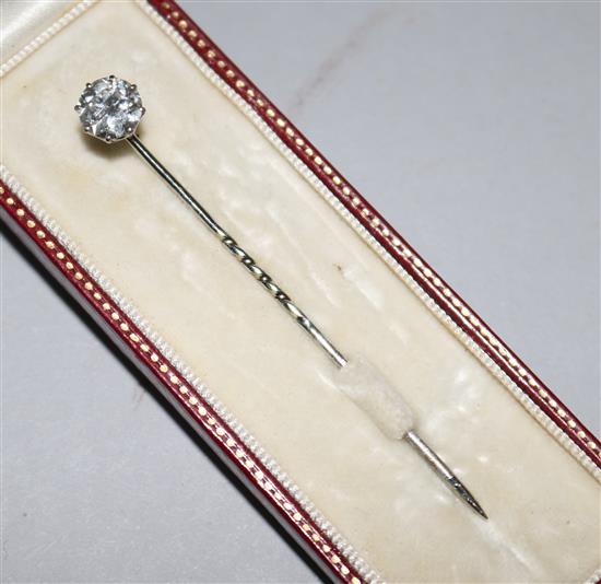 A mid 20th century white gold and solitaire diamond stick pin, 2.25in